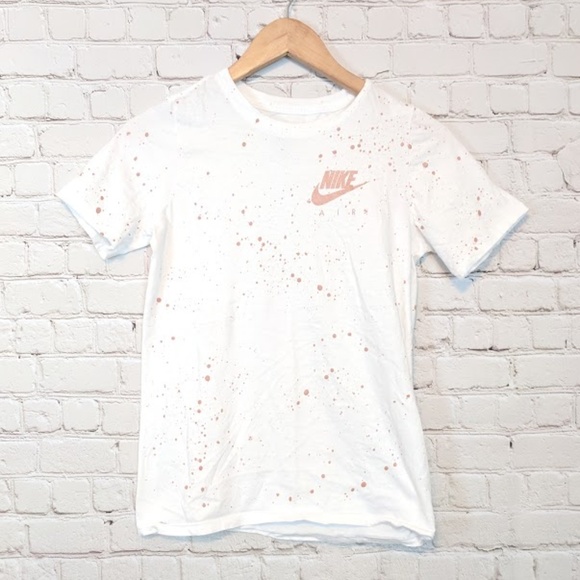 white and rose gold nike shirt